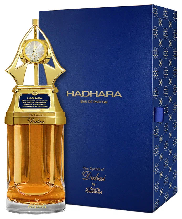 Hadhara von The Spirit of Dubai, goldener Flakon neben der dunkelblauen Verpackung
